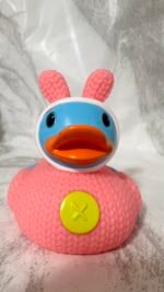 Cute pink duck with bear outfit