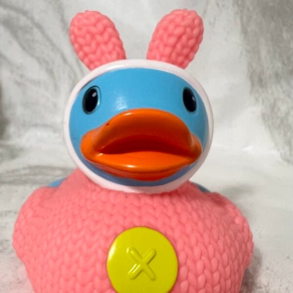 Cute pink duck with bear outfit